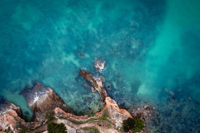 High angle view of rocks and sea