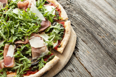 Close-up of pizza served on table