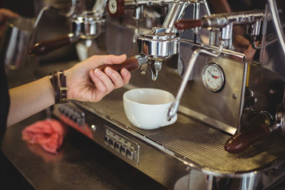 Hand holding coffee cup