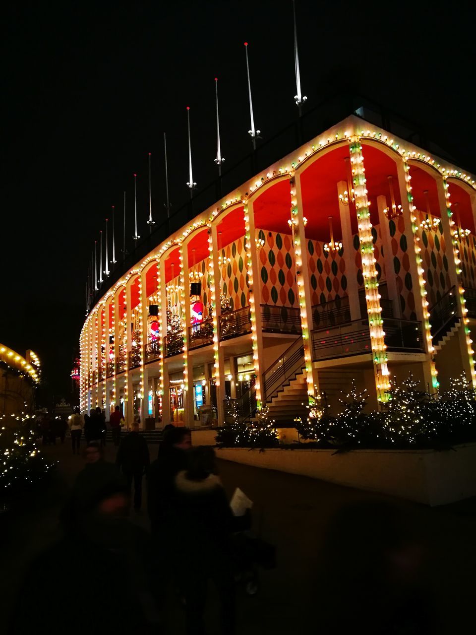 VIEW OF ILLUMINATED BUILDING AT NIGHT