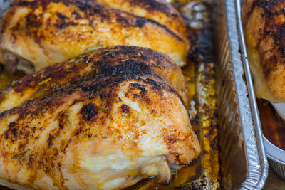 Close-up of meat in foil container