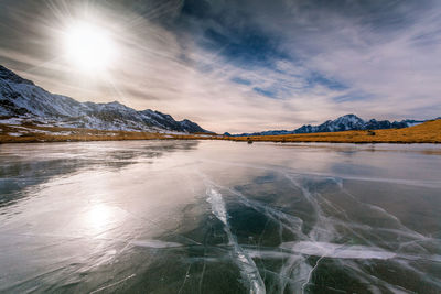 Scenic view of snowcapped mountains against sky during winter