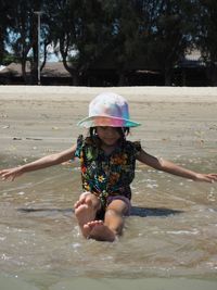 Girl in water in park