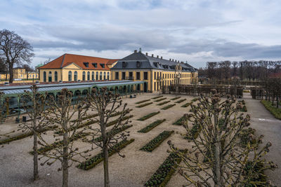 Houses and buildings against sky during winter