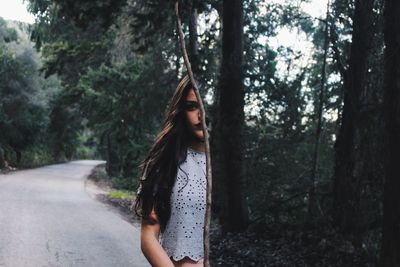 Portrait of young woman in forest