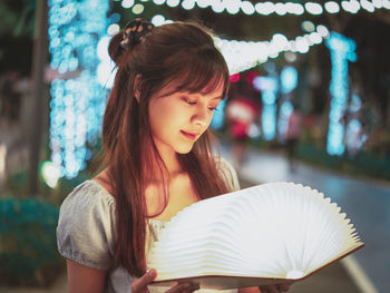 Portrait of young woman looking at camera