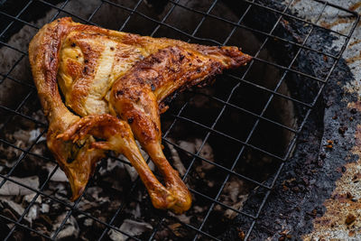 High angle view of meat on barbecue grill