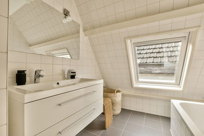 Low section of woman standing in bathroom