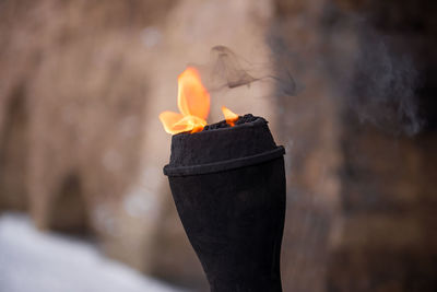 Close-up of flaming torch in castle