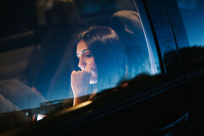 Beautiful woman sitting in car