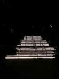 Staircase of building against sky at night