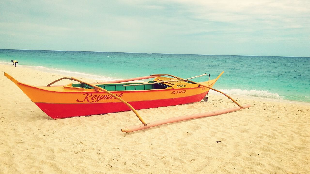 sea, beach, horizon over water, water, sand, shore, sky, tranquility, tranquil scene, scenics, nautical vessel, beauty in nature, boat, nature, vacations, absence, deck chair, moored, relaxation, idyllic