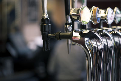 Close-up of faucet in row