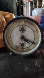 High angle view of clock on table