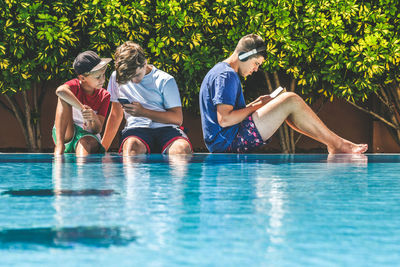 People sitting in swimming pool