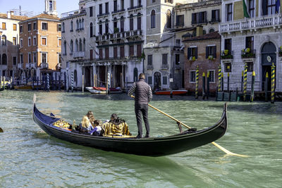 People on boat in canal