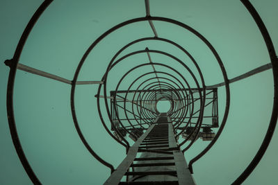 Low angle view of spiral staircase against sky