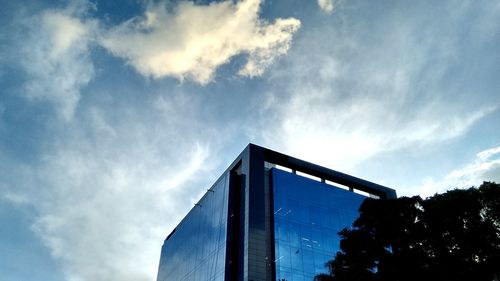 Low angle view of built structure against blue sky