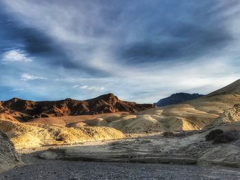 Scenic view of landscape against cloudy sky