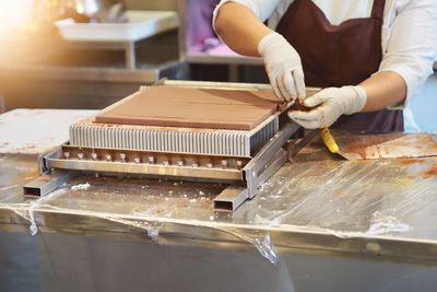 Person preparing food on table