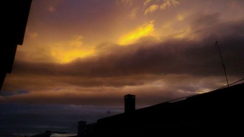 Low angle view of dramatic sky during sunset