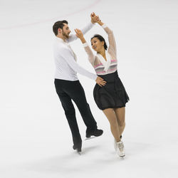 Full length of couple figure skating