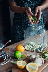 Midsection of man preparing food on table