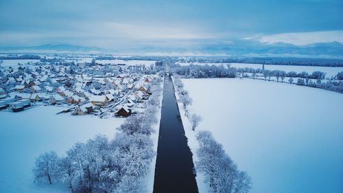 High angle view of snow covered landscape against sky