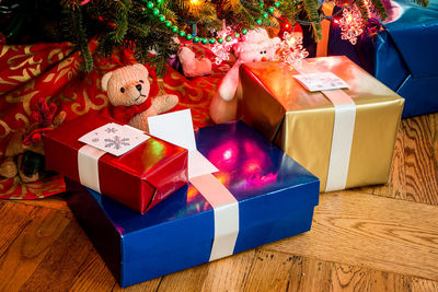 High angle view of gifts against christmas tree