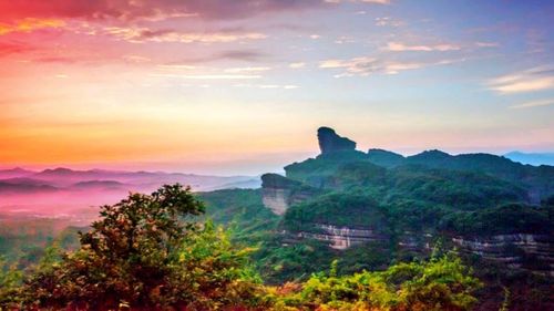 Scenic view of mountain against cloudy sky