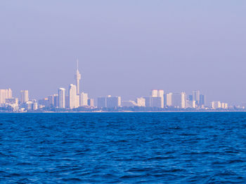 View of buildings in city against sky