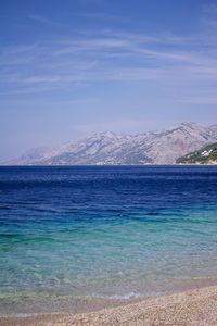 Scenic view of sea against blue sky