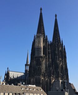 Low angle view of cathedral against blue sky