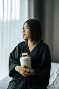 Young woman drinking coffee