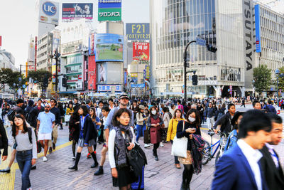 Group of people on street in city