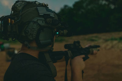 Close-up portrait of a man holding camera