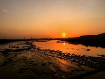 Scenic view of sea against sky during sunset