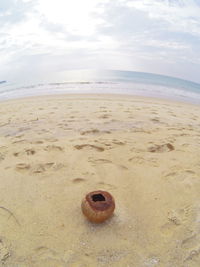 Close-up of sand on beach against sky