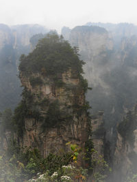 Scenic view of mountains during foggy weather