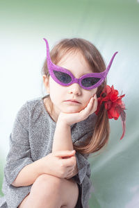 Portrait of cute girl wearing sunglasses