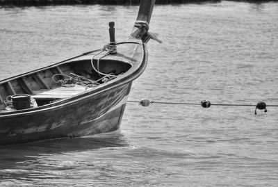 Close-up of boat sailing in sea