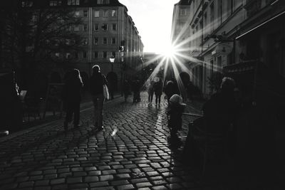 People walking on street in city