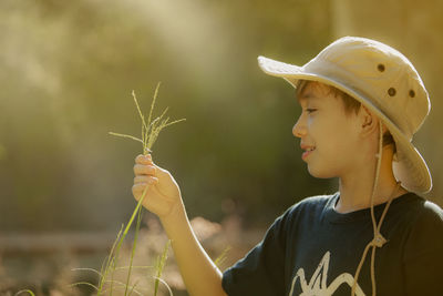 Portrait of man holding plant