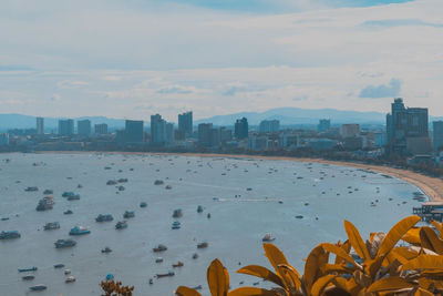 Scenic view of sea and buildings against sky