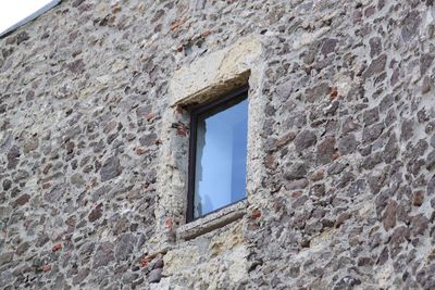 Low angle view of window of old building