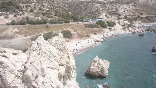 High angle view of rocks on sea shore