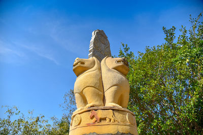 Low angle view of statue against sky