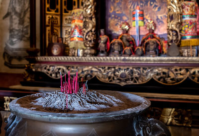 Lit candles in temple