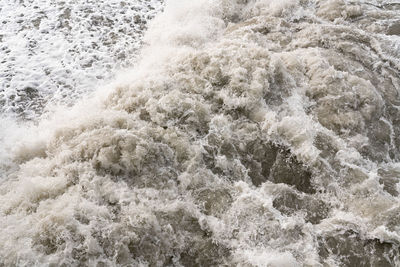 High angle view of water flowing in sea