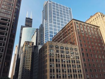 Low angle view of modern buildings against sky